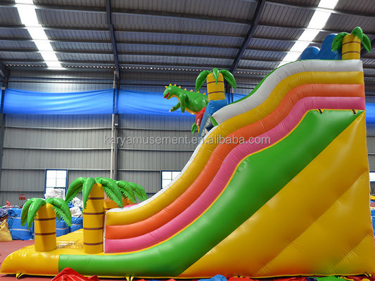 Jogos de parque ao ar livre 2 pistas Palmeira tropical PVC inflável Dinossauro Salto Salto Slide