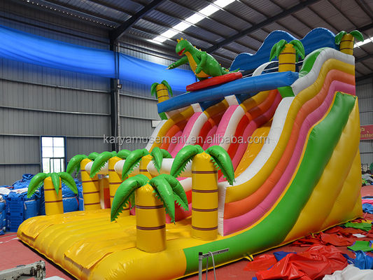 Jogos de parque ao ar livre 2 pistas Palmeira tropical PVC inflável Dinossauro Salto Salto Slide