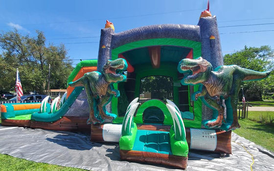 Dinossauros do Jurássico Casa de salto inflável de PVC comercial com escorrega com sopro